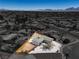 Aerial view of a fenced home showing the xeriscaped backyard with a small patch of turf at 2721 Bruce Cir, North Las Vegas, NV 89030
