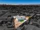 Aerial shot of the renovated backyard with xeriscaping and artificial turf at 2721 Bruce Cir, North Las Vegas, NV 89030