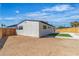 Cozy backyard with new fencing, desert landscaping, and a small grass patch at 2721 Bruce Cir, North Las Vegas, NV 89030