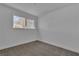 Bright bedroom features a window and neutral carpet at 2721 Bruce Cir, North Las Vegas, NV 89030