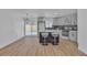 Modern kitchen features stainless appliances, gray cabinetry, a central island with seating, and a sliding glass door at 2721 Bruce Cir, North Las Vegas, NV 89030