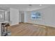 Bright living room features laminate flooring, neutral paint, and a large window bringing in plenty of natural light at 2721 Bruce Cir, North Las Vegas, NV 89030