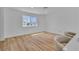 Bright living space has stylish chairs, wood floors, white walls, and a large window overlooking the front yard at 2721 Bruce Cir, North Las Vegas, NV 89030