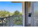 Cozy balcony with metal railing overlooking green trees, a street and the surrounding neighborhood at 29 Montelago Blvd # 213, Henderson, NV 89011