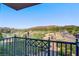 Scenic view from the balcony showcasing a lake, desert landscape and mountain range against a clear blue sky at 29 Montelago Blvd # 213, Henderson, NV 89011