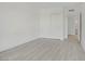 Bedroom featuring wood-style flooring, white walls, and closet space at 29 Montelago Blvd # 213, Henderson, NV 89011