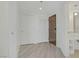 Hallway view with multiple doors leading to different rooms and a sink visible at 29 Montelago Blvd # 213, Henderson, NV 89011