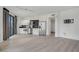 Modern kitchen with stainless steel appliances and black countertops, open to the living area at 29 Montelago Blvd # 213, Henderson, NV 89011