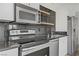 Close-up of a kitchen area featuring stainless steel appliances and modern cabinetry at 29 Montelago Blvd # 213, Henderson, NV 89011