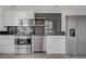 Modern kitchen featuring stainless steel appliances, white cabinetry, and sleek countertops at 29 Montelago Blvd # 213, Henderson, NV 89011