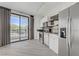 Modern kitchen with stainless steel appliances and a sliding door to the balcony at 29 Montelago Blvd # 213, Henderson, NV 89011