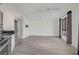 Bright and spacious living area with wood-style flooring and large window at 29 Montelago Blvd # 213, Henderson, NV 89011