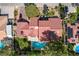 Stunning aerial view of the home showcasing a refreshing pool and lush landscaping at 3151 Coachlight Cir, Las Vegas, NV 89117