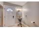 Unique bathroom features a pedestal sink, ornate mirror, and stylish fixtures with a door to the shower at 3151 Coachlight Cir, Las Vegas, NV 89117