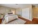 Bedroom features a neutral color scheme, comfortable bed, and a convenient closet space with sliding doors at 3151 Coachlight Cir, Las Vegas, NV 89117