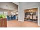 Open entryway featuring wood floors and views into the kitchen and dining room with chandelier at 3151 Coachlight Cir, Las Vegas, NV 89117