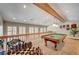 Upper-level game room featuring a pool table, lots of light from surrounding windows, and fun decor at 3151 Coachlight Cir, Las Vegas, NV 89117