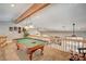Upper level game room featuring a pool table and plenty of space for games and activities at 3151 Coachlight Cir, Las Vegas, NV 89117