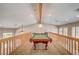 Spacious game room on the second floor featuring a pool table and ample lighting for entertainment and relaxation at 3151 Coachlight Cir, Las Vegas, NV 89117