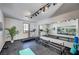 Bright home gym with mirrors and equipment including a treadmill, pilates machine, yoga mat, and free weights at 3151 Coachlight Cir, Las Vegas, NV 89117