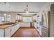 Well-lit kitchen featuring a gas range, stainless steel appliances and tile flooring at 3151 Coachlight Cir, Las Vegas, NV 89117