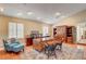Spacious home office with hardwood floors, lots of natural light, and custom wooden desk and storage at 3151 Coachlight Cir, Las Vegas, NV 89117