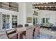 Charming outdoor space featuring ceiling fans, outdoor furniture, and French doors leading to interior of house at 3151 Coachlight Cir, Las Vegas, NV 89117
