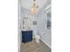 Chic half-bath featuring designer fixtures, a unique vanity, and a decorative light fixture at 3171 Biccari Ave, Henderson, NV 89044