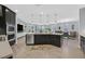 Open kitchen featuring an island, stainless steel appliances, and a seamless transition to the dining area at 3171 Biccari Ave, Henderson, NV 89044
