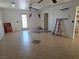 Spacious bonus room features neutral tile and outdoor access at 3261 Winery Rd, Pahrump, NV 89048