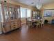Elegant dining room with wood floors, chandelier, and a large china cabinet at 3261 Winery Rd, Pahrump, NV 89048