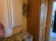 Bright laundry area with wooden cabinet and utility storage at 3261 Winery Rd, Pahrump, NV 89048