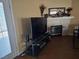 Cozy living room area with a fireplace and tile surround at 3261 Winery Rd, Pahrump, NV 89048