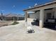 An inviting covered patio with a grill, perfect for outdoor dining and entertaining at 3261 Winery Rd, Pahrump, NV 89048