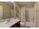 Clean bathroom with a shower-tub combo, modern vanity, and neutral decor for a comfortable space at 3707 Paseo De Paz Ave, Las Vegas, NV 89115