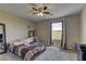 This bright bedroom features plush carpet, lots of natural light and an overhead ceiling fan at 3707 Paseo De Paz Ave, Las Vegas, NV 89115