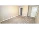 Carpeted bedroom with access to closet and doorway at 3707 Paseo De Paz Ave, Las Vegas, NV 89115