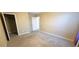 Simple bedroom space with beige walls, carpet, and closet space at 3707 Paseo De Paz Ave, Las Vegas, NV 89115