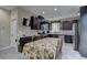 Well-equipped kitchen with modern appliances, dark wood cabinetry, and ample counter space at 3707 Paseo De Paz Ave, Las Vegas, NV 89115