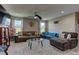 Spacious living room with carpet, comfortable seating, ceiling fan and plenty of natural light at 3707 Paseo De Paz Ave, Las Vegas, NV 89115