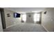 Large living room with plush carpeting, ample natural light, and a comfortable, inviting ambiance at 3707 Paseo De Paz Ave, Las Vegas, NV 89115