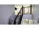 Modern staircase with sleek railings leading to the upper level, offering contemporary design at 3707 Paseo De Paz Ave, Las Vegas, NV 89115