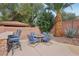 Outdoor patio features full kitchen, barstool seating area, landscaping and a tiki accent at 4042 Keefe Falls Ct, North Las Vegas, NV 89085
