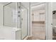 Bathroom featuring glass enclosed shower and walk-in closet with ample storage space at 4042 Keefe Falls Ct, North Las Vegas, NV 89085