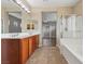 A spacious bathroom features dual sinks, a shower, and an adjoining bedroom at 4042 Keefe Falls Ct, North Las Vegas, NV 89085