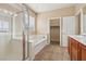 Bathroom featuring dual sinks, a separate shower, and a bathtub at 4042 Keefe Falls Ct, North Las Vegas, NV 89085