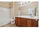 Bathroom featuring double sinks, a vanity, and a shower-tub combination at 4042 Keefe Falls Ct, North Las Vegas, NV 89085