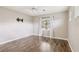 This bedroom has hardwood floors, a ceiling fan, and a wall-mounted TV at 4042 Keefe Falls Ct, North Las Vegas, NV 89085