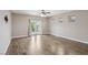 Bedroom with hardwood flooring, neutral paint, recessed lighting, and french doors to the balcony at 4042 Keefe Falls Ct, North Las Vegas, NV 89085