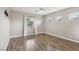 This spacious bedroom boasts hardwood floors and plenty of natural light at 4042 Keefe Falls Ct, North Las Vegas, NV 89085